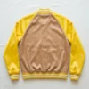 Light brown body and yellow raglan sleeves satin varsity jacket back.