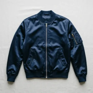 Navy blue satin ma‑1 flight bomber jacket.