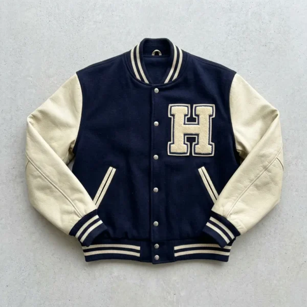 Navy blue full sleeves letterman jacket.