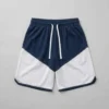 Custom navy and white two-tone basketball shorts front.