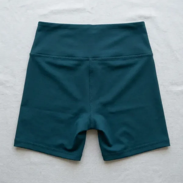 Back view of custom spandex teal screen-printed booty shorts.