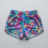 Front view of custom sublimated booty shorts with all-over abstract floral pattern printed.