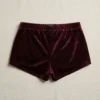 Back view of marron custom velvet booty shorts.