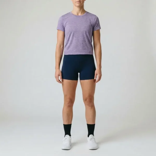 A women wearing a heater purple t-shirt with navy-blue custom booty shorts.