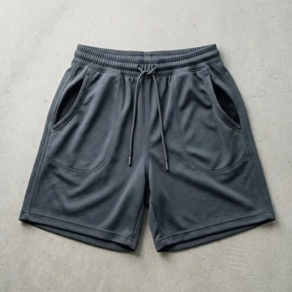 Gray basketball shorts with simple side pockets.
