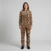 Front view of a woman wearing caramel brushstroke leopard print velour tracksuit.