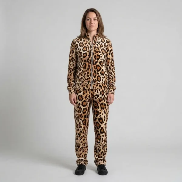 Front view of a woman wearing caramel brushstroke leopard print velour tracksuit.