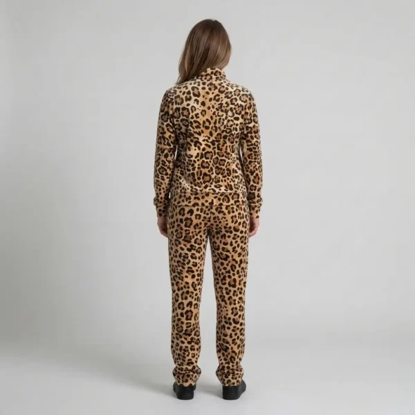 Back view of a woman wearing caramel cream leopard print velour tracksuit.