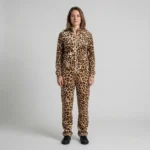Front view of a woman wearing caramel cream leopard print velour tracksuit.