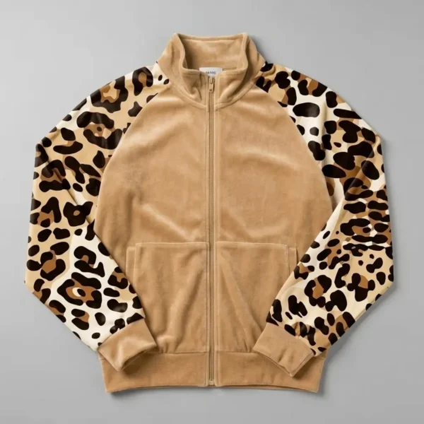 A caramel cream velour track jacket with leopard print raglan sleeves.