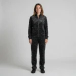 Front view of a woman wearing charcoal abstract leopard print velour tracksuit.