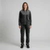 Front view of a woman wearing charcoal tonal spotted animal print velour tracksuit.
