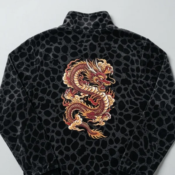 Back view of black leopard printed velour track jacket with DTF printed dragon sticker.