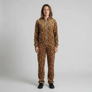 Front view of a woman wearing golden tan leopard print velour tracksuit.