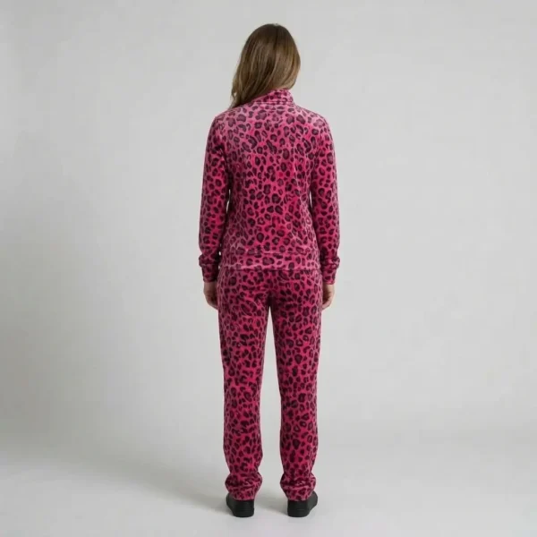 Back view of a woman wearing hot pink leopard print velour tracksuit.