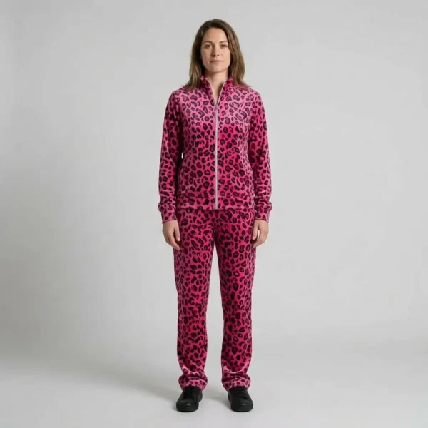 Front view of a woman wearing hot pink leopard print velour tracksuit.