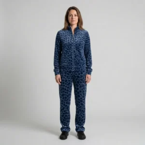 Front view of a woman wearing navy blue spotted animal print velour tracksuit.