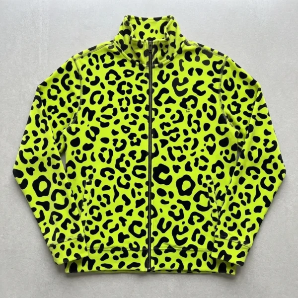 Flat lay shot of a neon lime full zipper leopard print velour track jacket.