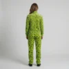 Back view of a woman wearing neon lime leopard print velour tracksuit.