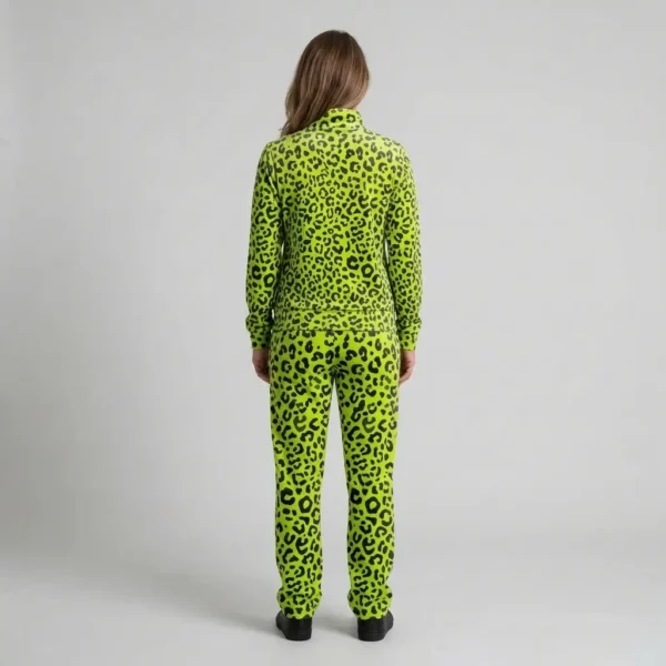 Back view of a woman wearing neon lime leopard print velour tracksuit.
