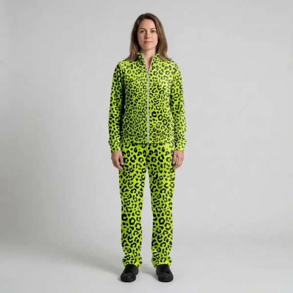 Front view of a woman wearing neon lime leopard print velour tracksuit.