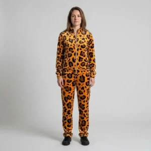 Front view of a woman wearing orange leopard print velour tracksuit.
