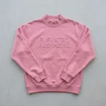 Pink embossed mock neck sweatshirt front.