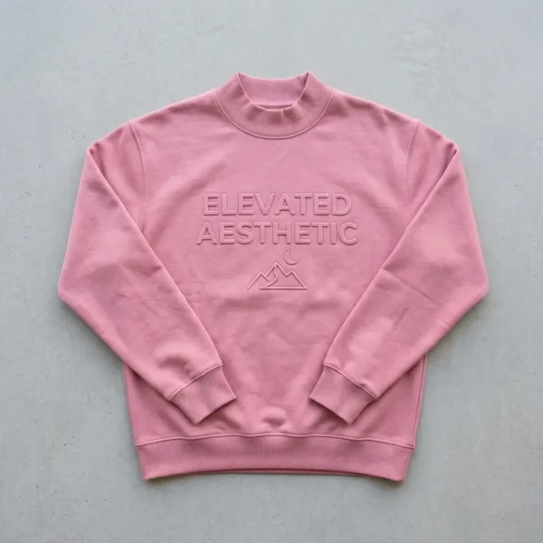 Pink embossed mock neck sweatshirt front.