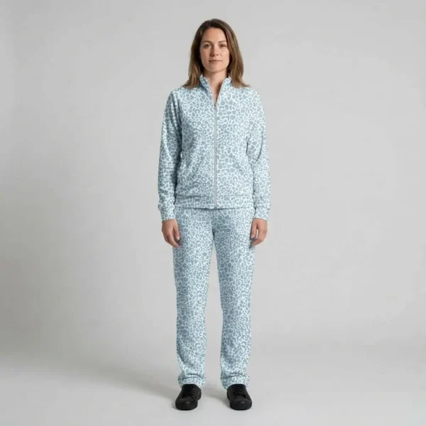 Front view of a woman wearing powder blue leopard print velour tracksuit.