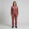 Front view of a woman wearing red blush pink leopard print velour tracksuit.