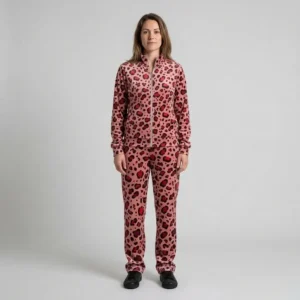 Front view of a woman wearing red blush pink leopard print velour tracksuit.