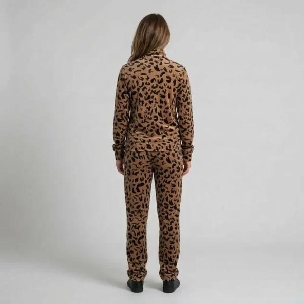 Back view of a woman wearing tan abstract leopard print velour tracksuit.