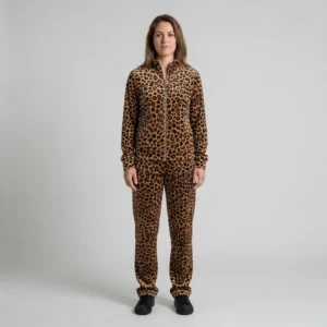 Front view of a woman wearing warm brown leopard print velour tracksuit.
