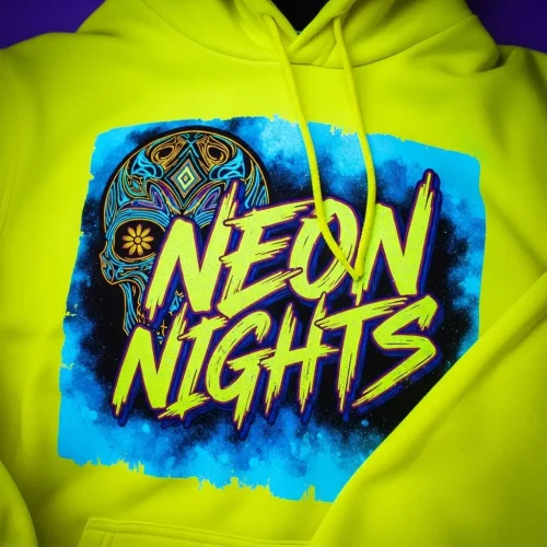uv-blacklight-reactive-screen-printed-hoodie-closeup Neon yellow hoodie featuring a blacklight reactive print of a sugar skull design and "NEON NIGHTS" text in bright, electric colors.
